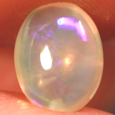 SOLID CRYSTAL OPAL Transparent with sparkles of green and purple